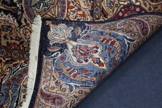 A Persian blue ground carpet, 13ft 1in by 9ft 8in.